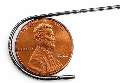 Milliscope HDX micro borescope bent around a US penny for scale